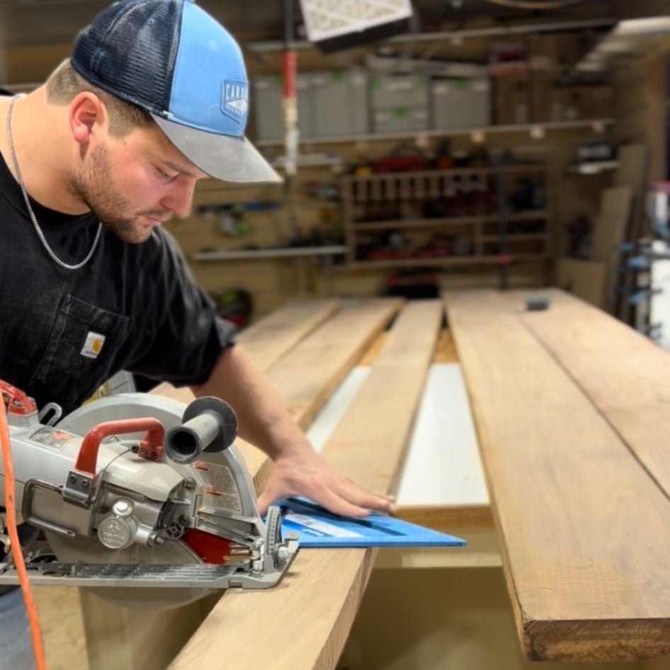 Harrison Strong working on a custom wood dining table in the shop